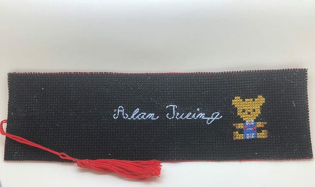 Alan Turing and Porgy on a black background bookmark