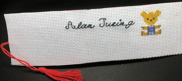 Alan Turing and Porgy on a white backgound bookmark